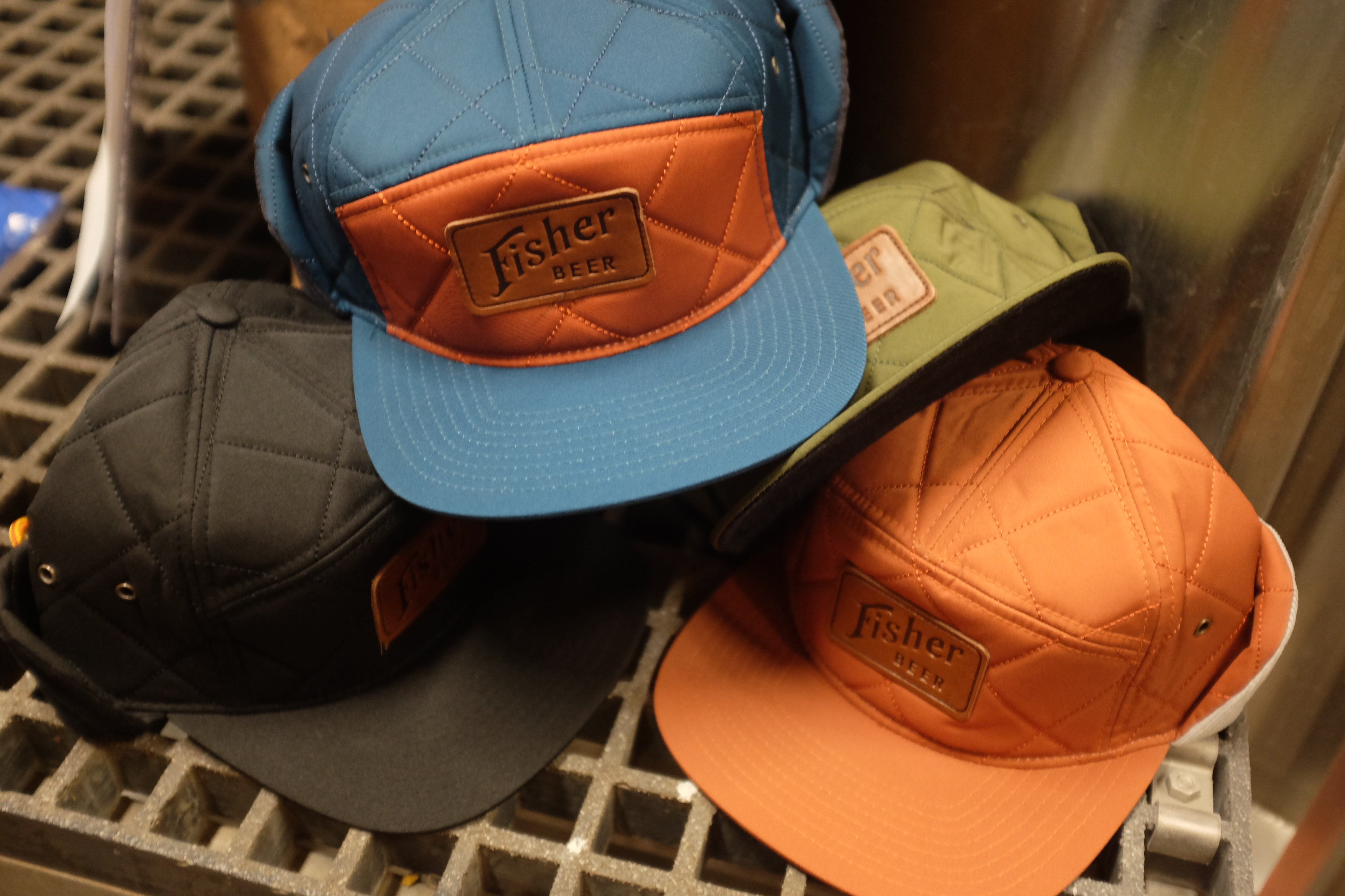 Quilted Ear Flap Leather Patch Hats | Fisher Brewing Company